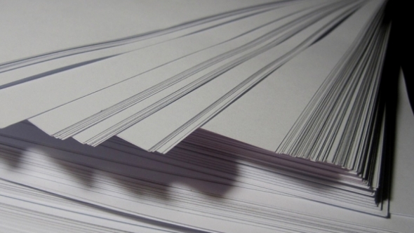 A photograph of a stack of printer paper. 